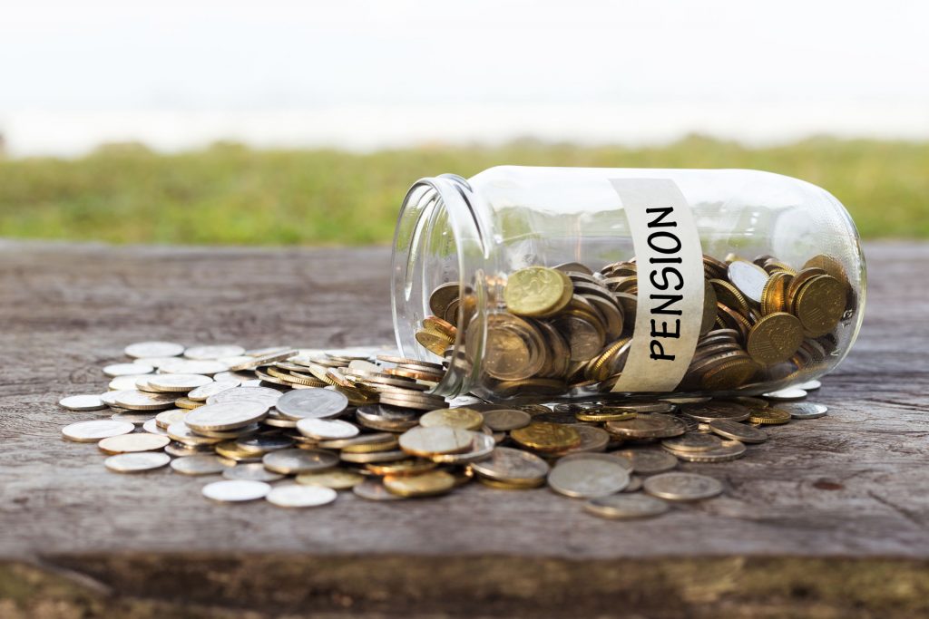 Money spilling out of a pension savings jar